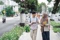 Couple student chatting while walk to campus Royalty Free Stock Photo