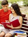 Couple student with notebook outdoor. Royalty Free Stock Photo