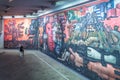 A couple of students analyzing the Presence of Latin America mural painted by Mexican artist Jorge GonzÃÂ¡lez Camarena in 1965