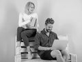 Couple students with book and laptop studying. Modern students use digital approach instead outdated. Man and woman use Royalty Free Stock Photo