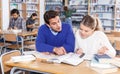 Couple of students studying in library Royalty Free Stock Photo