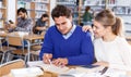 Couple of students studying in library Royalty Free Stock Photo