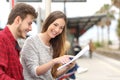 Couple of students studying in a train station