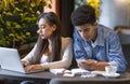 Couple of students using technologies in studying Royalty Free Stock Photo