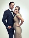 Couple, studio and portrait with smile, vintage and fashion for rich retro romance. Man, woman and model with tuxedo Royalty Free Stock Photo