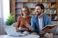 Couple studying and discussing online learning from home Royalty Free Stock Photo