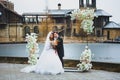 Close-up portraits of stylish newlyweds on the territory of country hotel