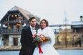 Close-up portraits of stylish newlyweds on the territory of country hotel