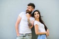 Couple stylish young modern people. Couple in love hang out together grey wall background. Urban loving couple. Couple Royalty Free Stock Photo