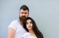 Couple stylish young modern people. Urban loving couple. Couple white shirts lean each other. Hipster bearded and Royalty Free Stock Photo