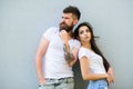 Couple stylish youth. Couple white shirts cuddle each other. Romantic couple. Couple in love hang out together grey wall Royalty Free Stock Photo