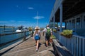 Couple on summer vacation enjoying walk on the waterfront.