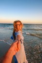 Couple summer vacation travel - Woman walking on romantic honeymoon beach holidays holding hand of boyfriend following her Royalty Free Stock Photo