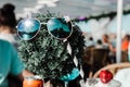 a couple of sunglasses sitting on top of a wooden post