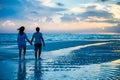 Couple at sunrise on a beach Royalty Free Stock Photo