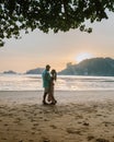 Couple during sunset on the beach Krabi Thailand, men and woman watching sunset at Ao Nam Mao beach Krabi Ao Nang area Royalty Free Stock Photo