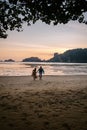 Couple during sunset on the beach Krabi Thailand, men and woman watching sunset at Ao Nam Mao beach Krabi Ao Nang area Royalty Free Stock Photo