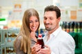 Couple in supermarket buying beverages Royalty Free Stock Photo