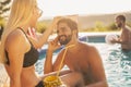 Couple at a swimming pool party Royalty Free Stock Photo