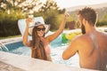 Couple at the swimming pool party Royalty Free Stock Photo