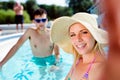 Couple in the swimming pool taking selfie. Summer and water. Royalty Free Stock Photo