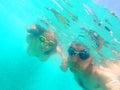 Couple swimming underwater in the sea Royalty Free Stock Photo