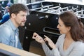 Couple beside table football game holding ball Royalty Free Stock Photo