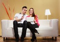 Couple with tablet and credit card at home buying Royalty Free Stock Photo