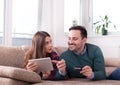 Couple with tablet and credit card at home Royalty Free Stock Photo