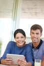 Couple, tablet and happy in house with portrait for movie, film and online streaming. Man, technology and woman with Royalty Free Stock Photo