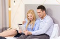 Couple with tablet pc computer in hotel room Royalty Free Stock Photo