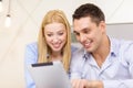 Couple with tablet pc computer in hotel room Royalty Free Stock Photo