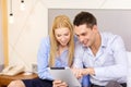 Couple with tablet pc computer in hotel room Royalty Free Stock Photo