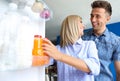 Couple taking bottle with juice out of refrigerator Royalty Free Stock Photo