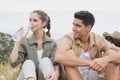 Couple taking break after hiking uphill Royalty Free Stock Photo