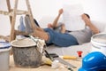 Couple taking break of painting house Royalty Free Stock Photo