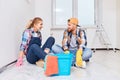 Couple taking a break from painting the walls Royalty Free Stock Photo