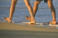 Couple Taking a Brisk Walk on Cabarete Bsy Royalty Free Stock Photo