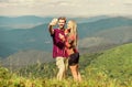 Couple taking photo. Summer vacation concept. Young adventurers. Travel together with darling. Couple in love hiking Royalty Free Stock Photo
