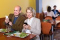 Couple taking photoes of meal . Royalty Free Stock Photo