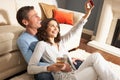 Couple Taking Photograph On Digital Camera At Home Royalty Free Stock Photo