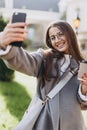 Young woman texting or using smartphone