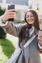 Young woman texting or using smartphone