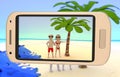 Couple taking a picture on the beach Royalty Free Stock Photo