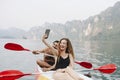 Couple taking picture while river rafting Royalty Free Stock Photo