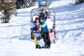 Couple taking selfie while lifting at mountain ski resort Royalty Free Stock Photo