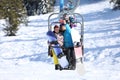 Couple taking selfie while lifting at mountain ski resort. Winter Royalty Free Stock Photo