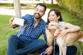 Couple taking selfie with their dog Royalty Free Stock Photo