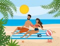 Couple taking sun in the beach Royalty Free Stock Photo