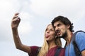 Couple taking a wacky selfie tongue out